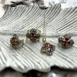 LeVian 18kt gold with Raspberry Rhodolite and chocolate diamonds. Set